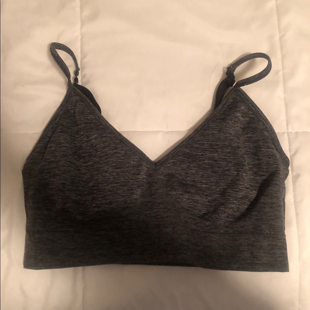A cute v-neck gray and black sport bra which is a extra large in girls.